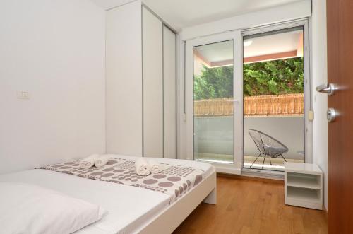 Ένα ή περισσότερα κρεβάτια σε δωμάτιο στο Apartment Luka