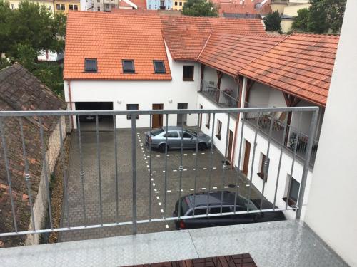 a car parked in a parking lot in front of a building at Apartmány Sebastian in Mikulov