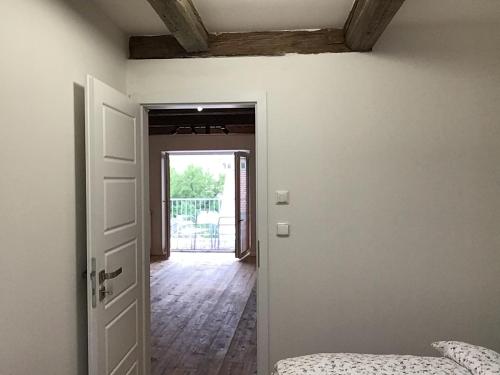 a room with an open door and a hallway at Apartmány Sebastian in Mikulov