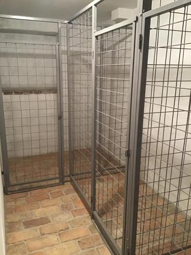 a pair of cage doors in a room at Apartmány Sebastian in Mikulov