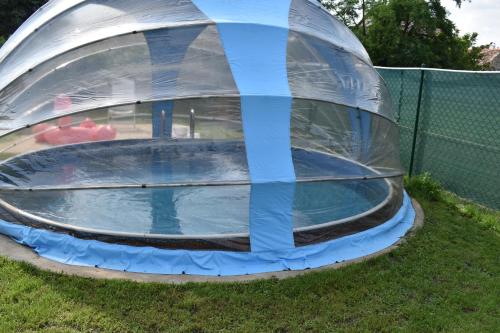 an inflatable trampoline in a dome in the grass at Chata 1 in Nový Přerov