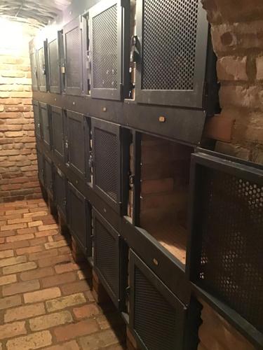 a row of black lockers in a building at Apartmány Sebastian in Mikulov
