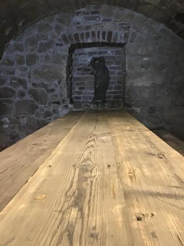 a statue of a person in a brick wall at Apartmány Sebastian in Mikulov