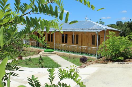 a house in the middle of a garden at Green Villa Tskaltubo in Tskaltubo