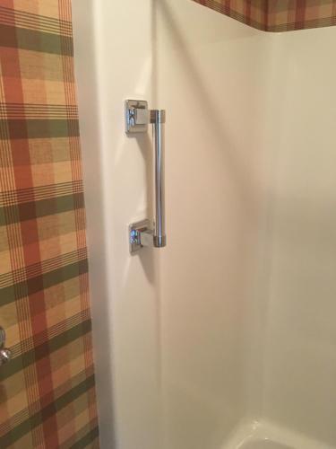 a white shower stall with a shower curtain at Downtown abode in the heart of the Bourbon Trail in Lebanon