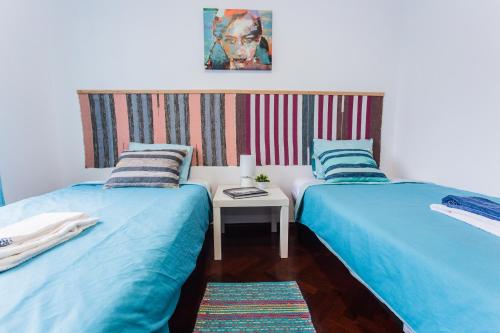 En eller flere senge i et værelse på Casa Azul Natura