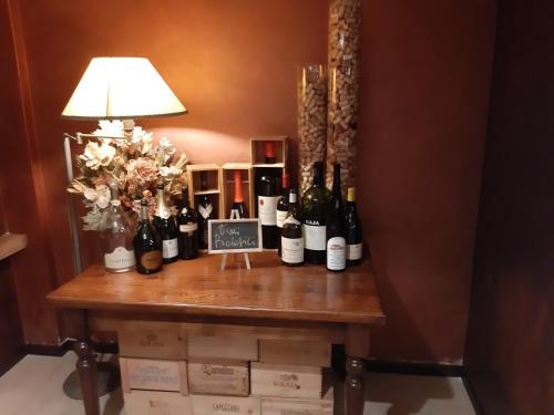 a bunch of bottles of wine on a table at Vivo Hotel in Pieve a Nievole