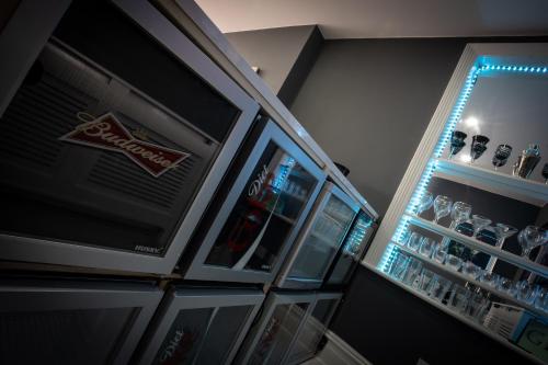 a refrigerator filled with drinks in a room at The Gables Hotel by Cherish Lewis Blackpool in Blackpool