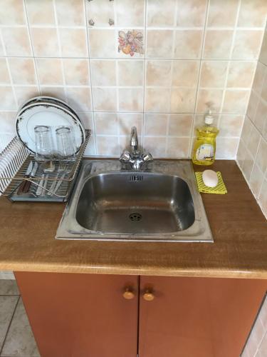 a sink in a kitchen with a counter top at Taygetos in Sparti