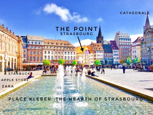 a city with a fountain in the middle of a street at The POINT CITY-Center - Place KLEBER in Strasbourg