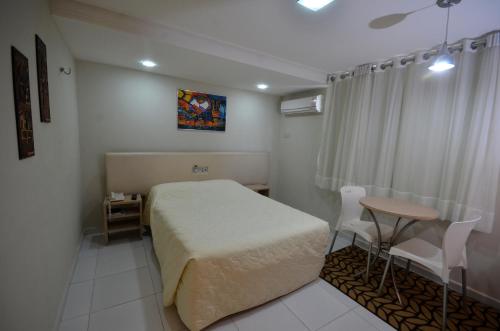 Ein Bett oder Betten in einem Zimmer der Unterkunft Hotel Sabino Palace