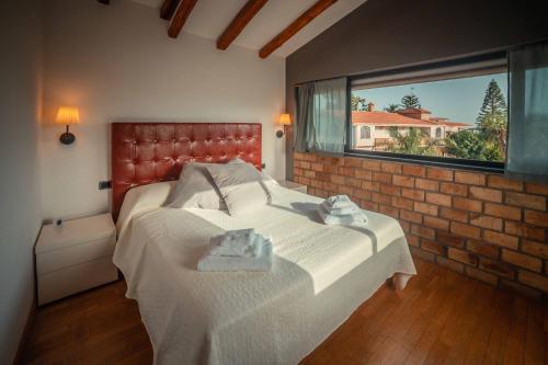 Ένα ή περισσότερα κρεβάτια σε δωμάτιο στο Casa Aurelio Wellness Suite & Spa Inclusive