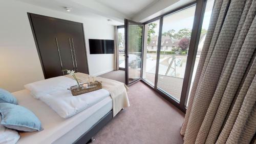 Postel nebo postele na pokoji v ubytování White Pearl Apartment 1.01