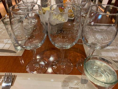 a group of wine glasses sitting on a table at Hotel HF in Farellones
