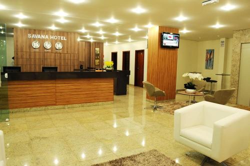 a lobby of a hotel with a reception desk at Savana Hotel in Uberlândia