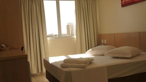 Cama ou camas em um quarto em Savana Hotel