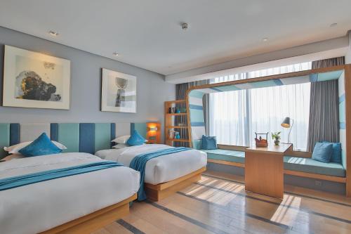 Postel nebo postele na pokoji v ubytování Shanghai Pagoda INNO Hotel