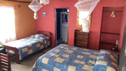 Ένα ή περισσότερα κρεβάτια σε δωμάτιο στο Hotel Las Aldas