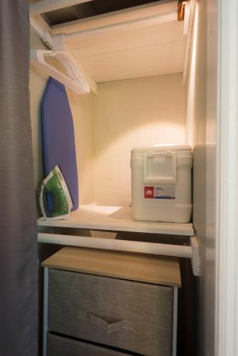 a refrigerator with its door open with a food container at The Blue Door Inn in Fort Lauderdale