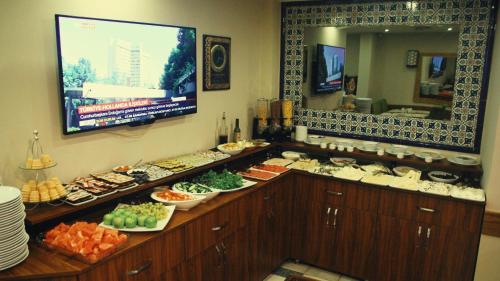 a buffet line with many different types of food at Hotel Ney in Konya