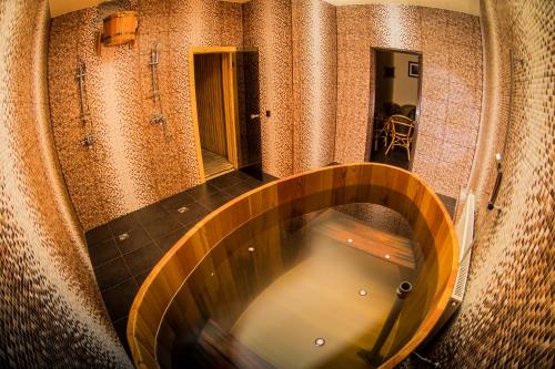 an overhead view of a wooden tub in a room at Hotel Complex Romantik in Arkhyz