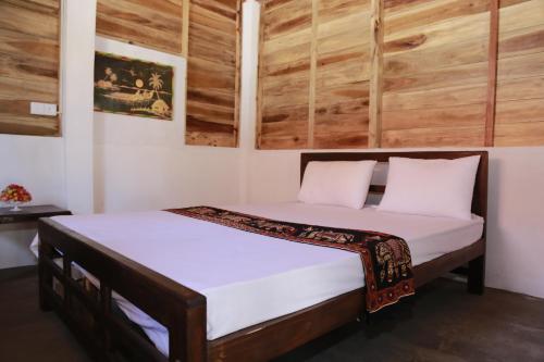 A bed or beds in a room at Ocean View Beach Resort - Kalpitiya