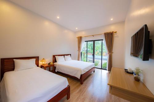 Giường trong phòng chung tại Son Doong Bungalow