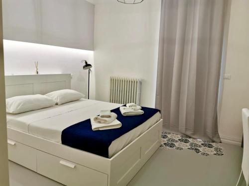 En eller flere senge i et værelse på Porta San Biagio Rooms