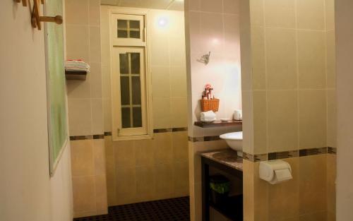 a bathroom with a sink and a toilet at Le Dung Hotel & Spa in Tam Kỳ