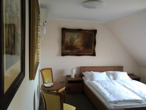 Llit o llits en una habitació de St. Hubert Vendégház