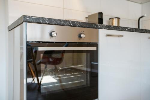 Η κουζίνα ή μικρή κουζίνα στο Stay Here ND Apartments