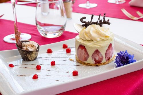a dessert on a white plate on a table at Hôtel Splendide in Crans-Montana