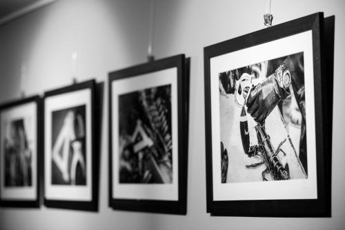 a group of framed pictures hanging on a wall at The Twelve Hotel in Barna