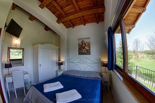 Postel nebo postele na pokoji v ubytování Agriturismo Baldassari