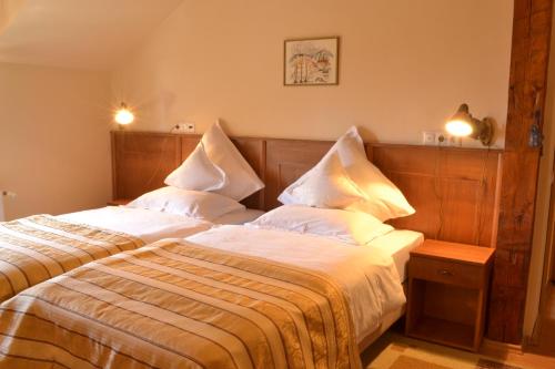 Postel nebo postele na pokoji v ubytování Hotel Bielmann