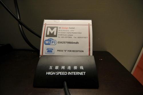 a high speed internet box sitting on top of a table at M Design Hotel @ Pandan Indah in Kuala Lumpur