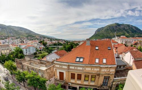 an overview of a city with mountains in the background at Luxury Studio Yasmine in Mostar