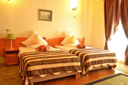 Postel nebo postele na pokoji v ubytování Hotel Bielmann