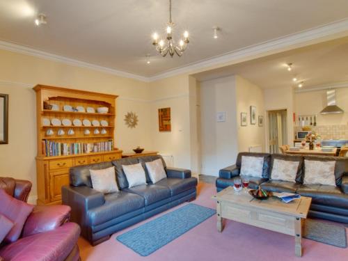 a living room with two couches and a coffee table at Apartment Sammys Place by Interhome in Hexham