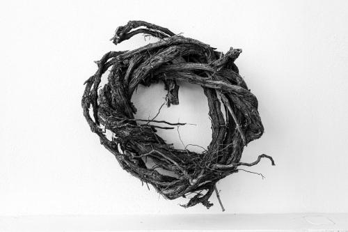 a wreath of branches on a white background at Santorini Crystal Blue Boutique Hotel in Kamari