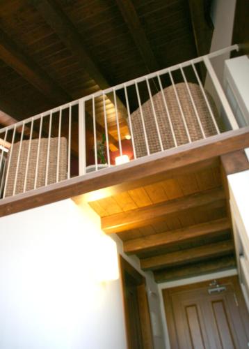 a stairwell of a building with a wooden railing at Hotel Castillo de Alquézar in Alquézar