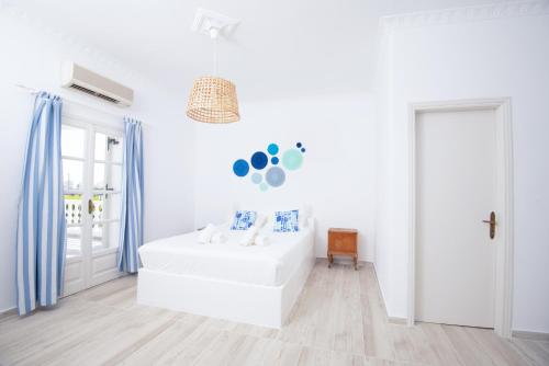 Кровать или кровати в номере Villa Markezinis