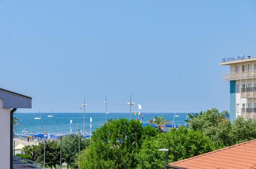 a view of the ocean and a hotel and a building at Hotel Perla Del Mare in Lido di Camaiore