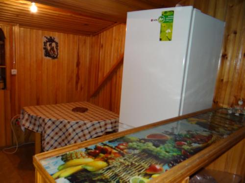 a refrigerator in a room with a display of fruit at Dalko in Borjomi