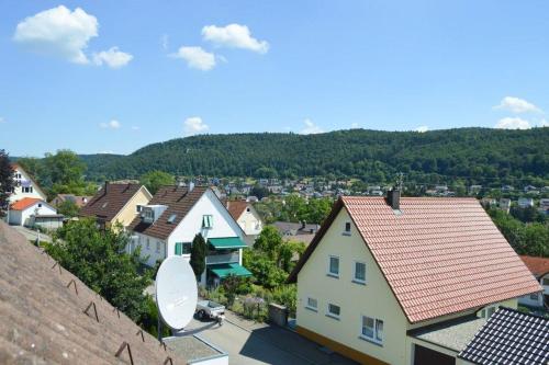a view of a town with houses and trees at Ferienwohnung Sonnenblick in Albstadt
