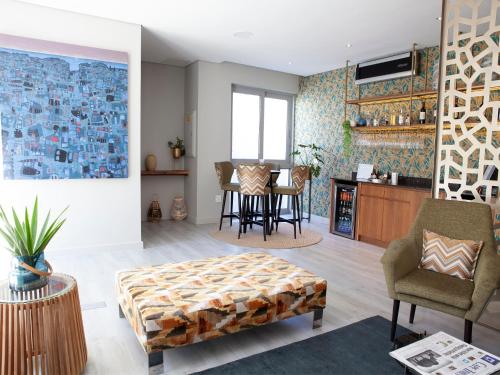 a living room with a table and chairs at Zest Boutique Hotel by The Living Journey Collection in Cape Town