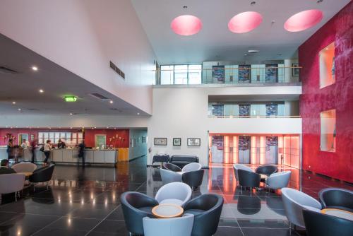 a waiting area in a hospital with chairs at Vila Gale Opera in Lisbon