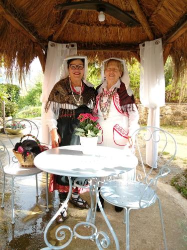a man and a woman sitting at a table at Petalo Rosso b&b in Lenola