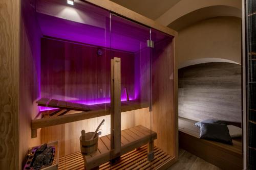 a sauna with purple lighting in a room at RESIDENZA DON ALBERTO in Ornano Grande