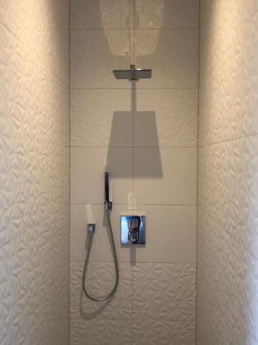a bathroom with a shower with a camera in it at Gîte Wellness Le Six H in Andolsheim